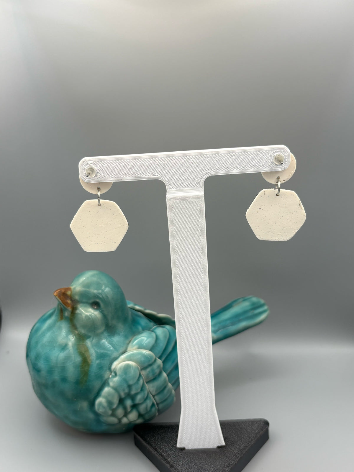 Black Cow Print Hexagon Dangle Earrings - handcrafted polymer clay earrings by Lakeside Clay