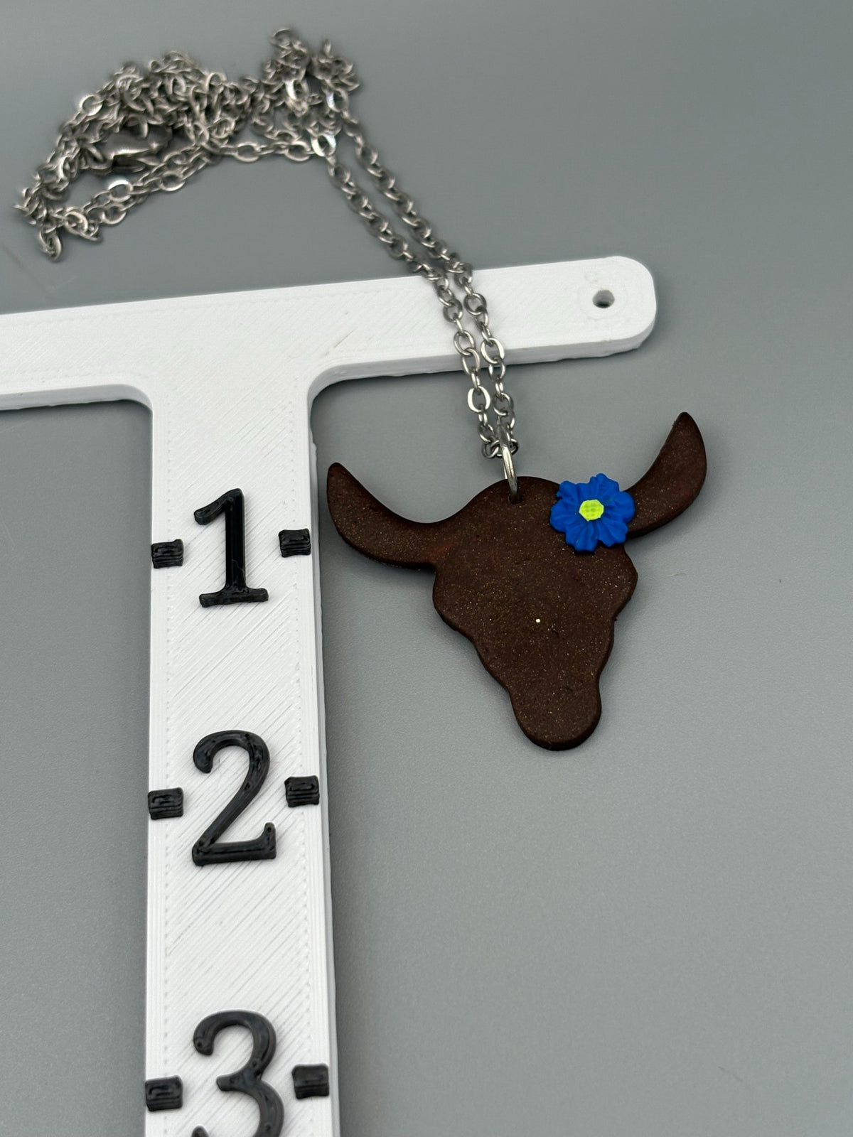 Steer with Blue Flower Necklace