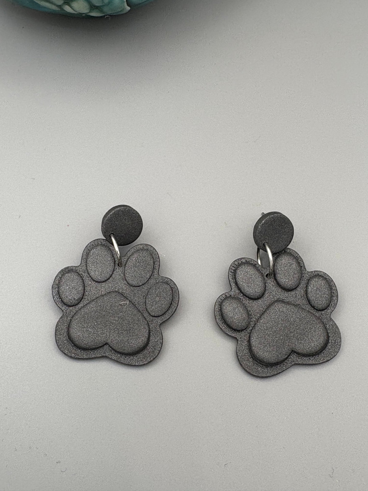 Graphite Paw Print Dangle Earrings - handcrafted polymer clay earrings by Lakeside Clay