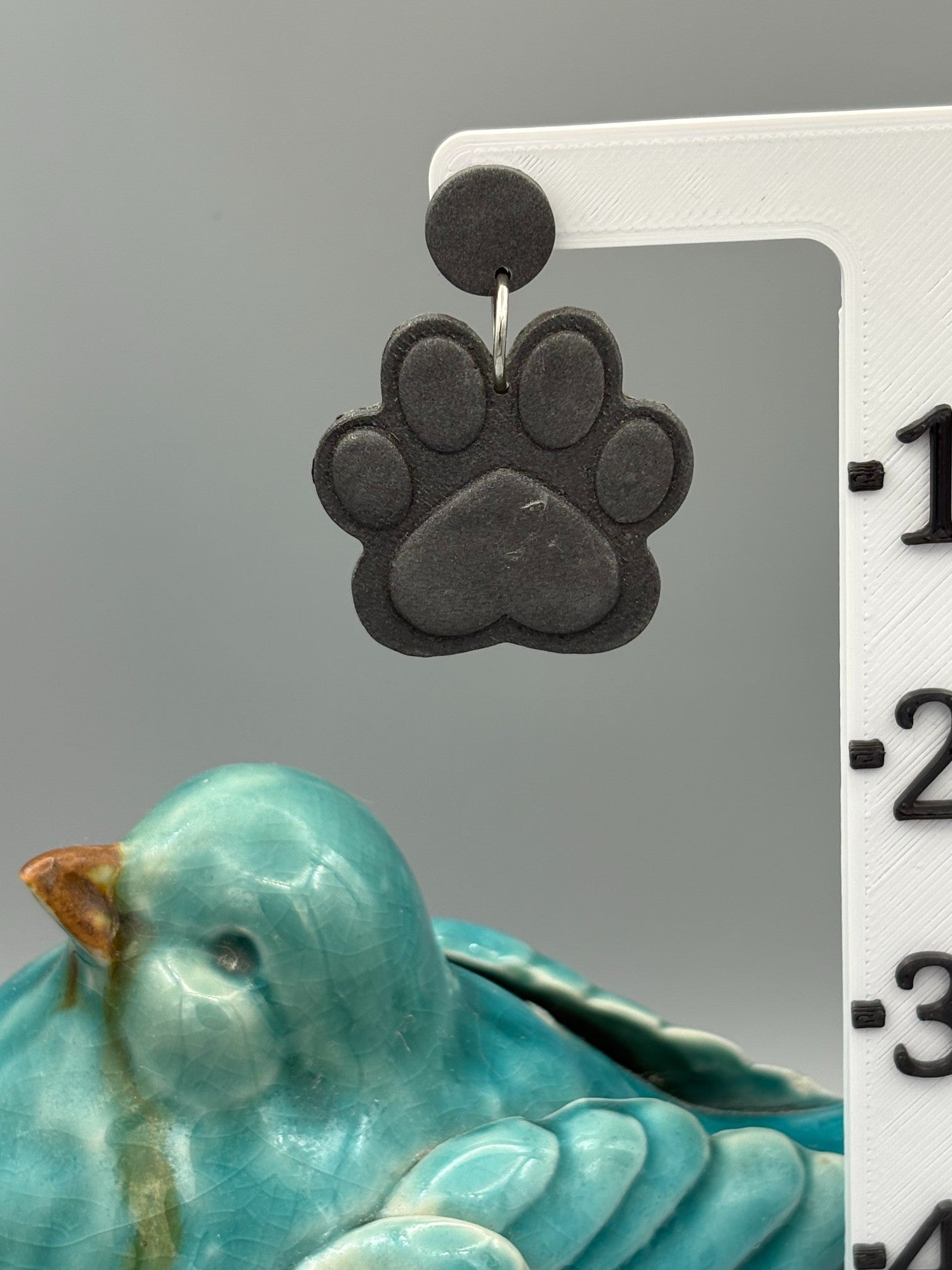 Graphite Paw Print Dangle Earrings - handcrafted polymer clay earrings by Lakeside Clay