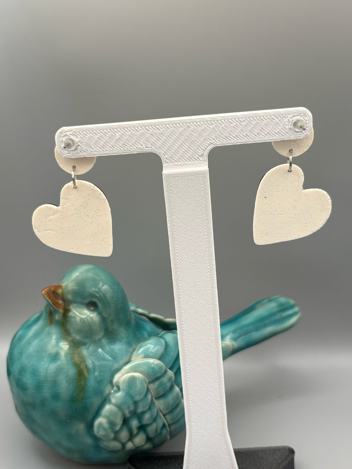 Cow Print Heart Dangle Earrings - handcrafted polymer clay earrings by Lakeside Clay