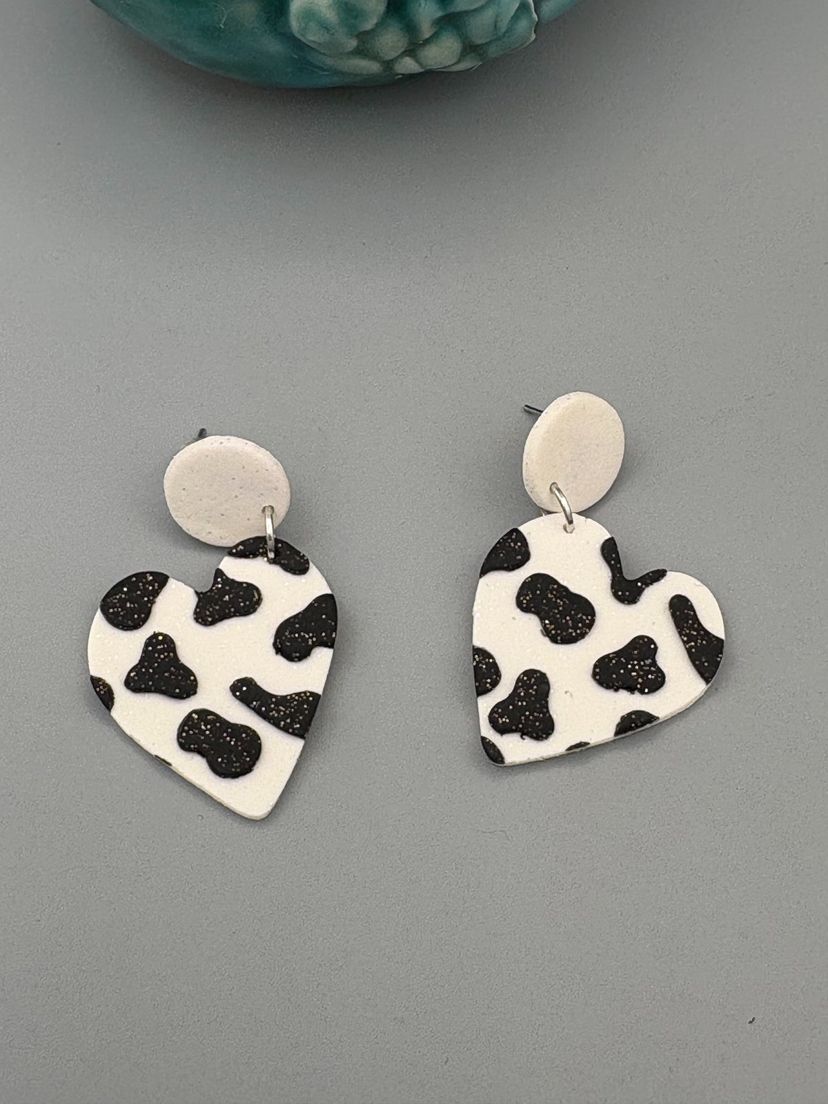 Cow Print Heart Dangle Earrings - handcrafted polymer clay earrings by Lakeside Clay