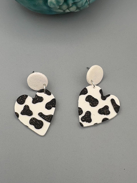 Cow Print Heart Dangle Earrings - handcrafted polymer clay earrings by Lakeside Clay