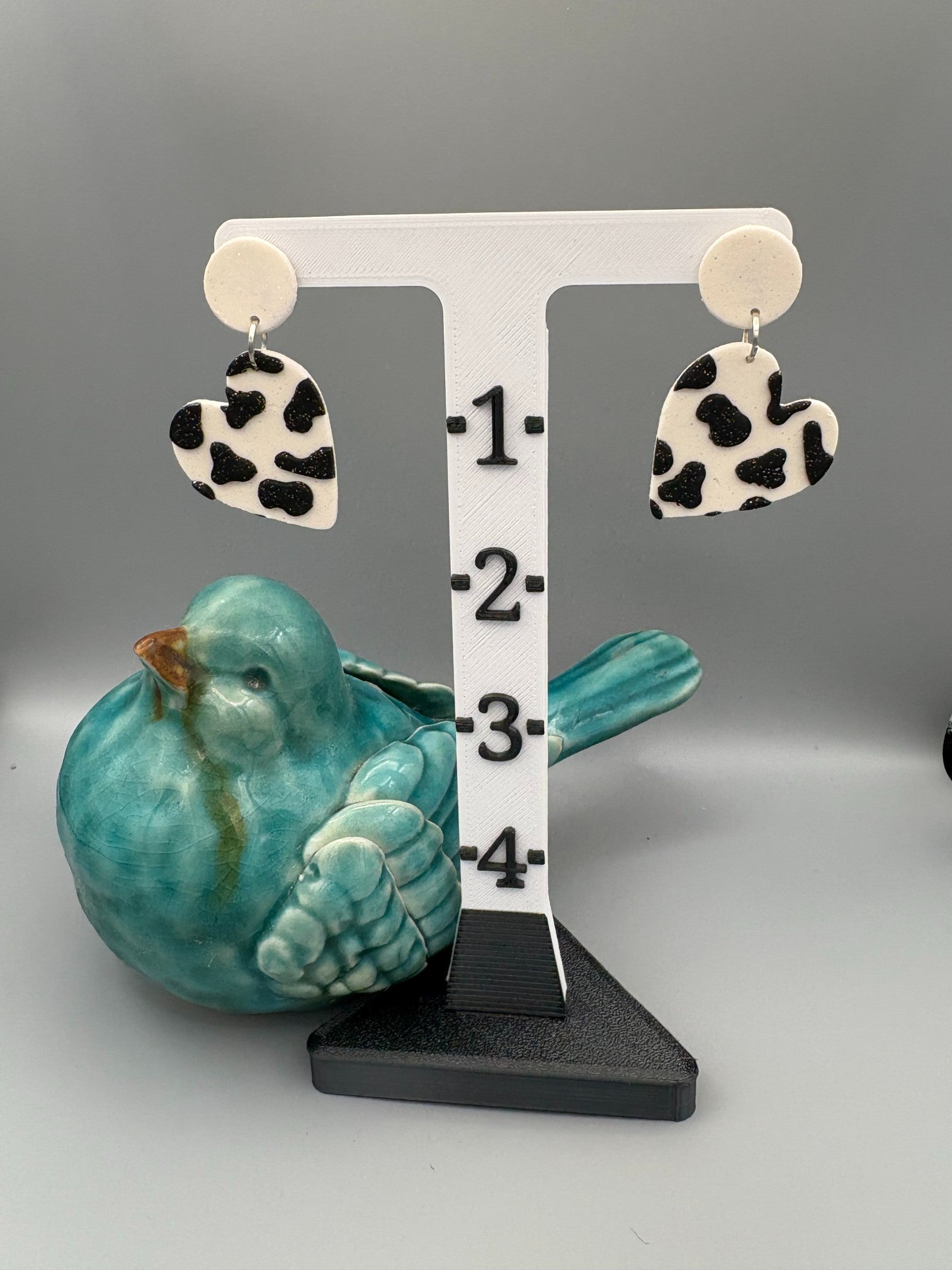 Cow Print Heart Dangle Earrings - handcrafted polymer clay earrings by Lakeside Clay