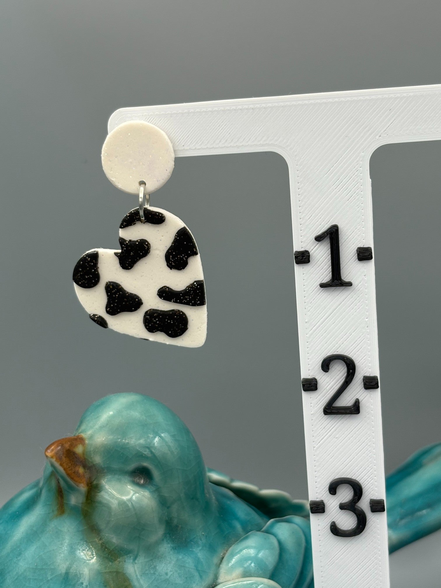 Cow Print Heart Dangle Earrings - handcrafted polymer clay earrings by Lakeside Clay
