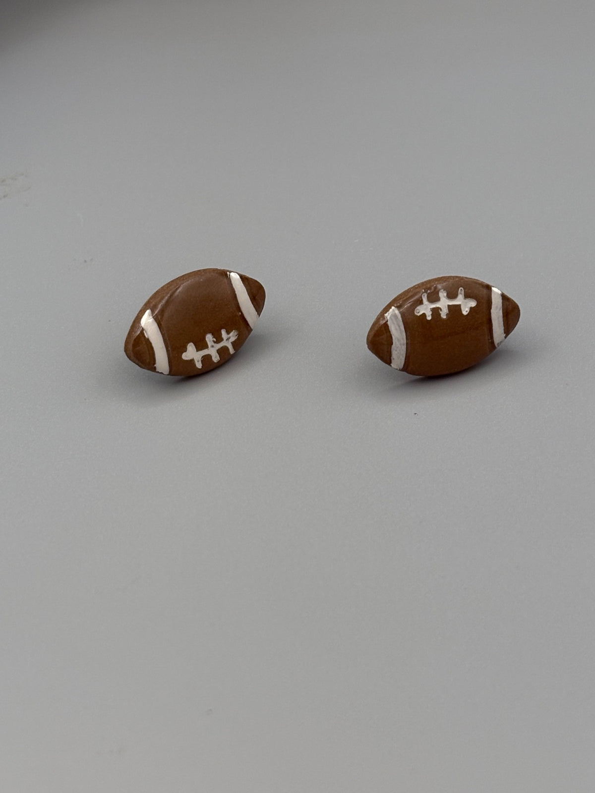 Football Stud Earrings - handcrafted polymer clay earrings by Lakeside Clay
