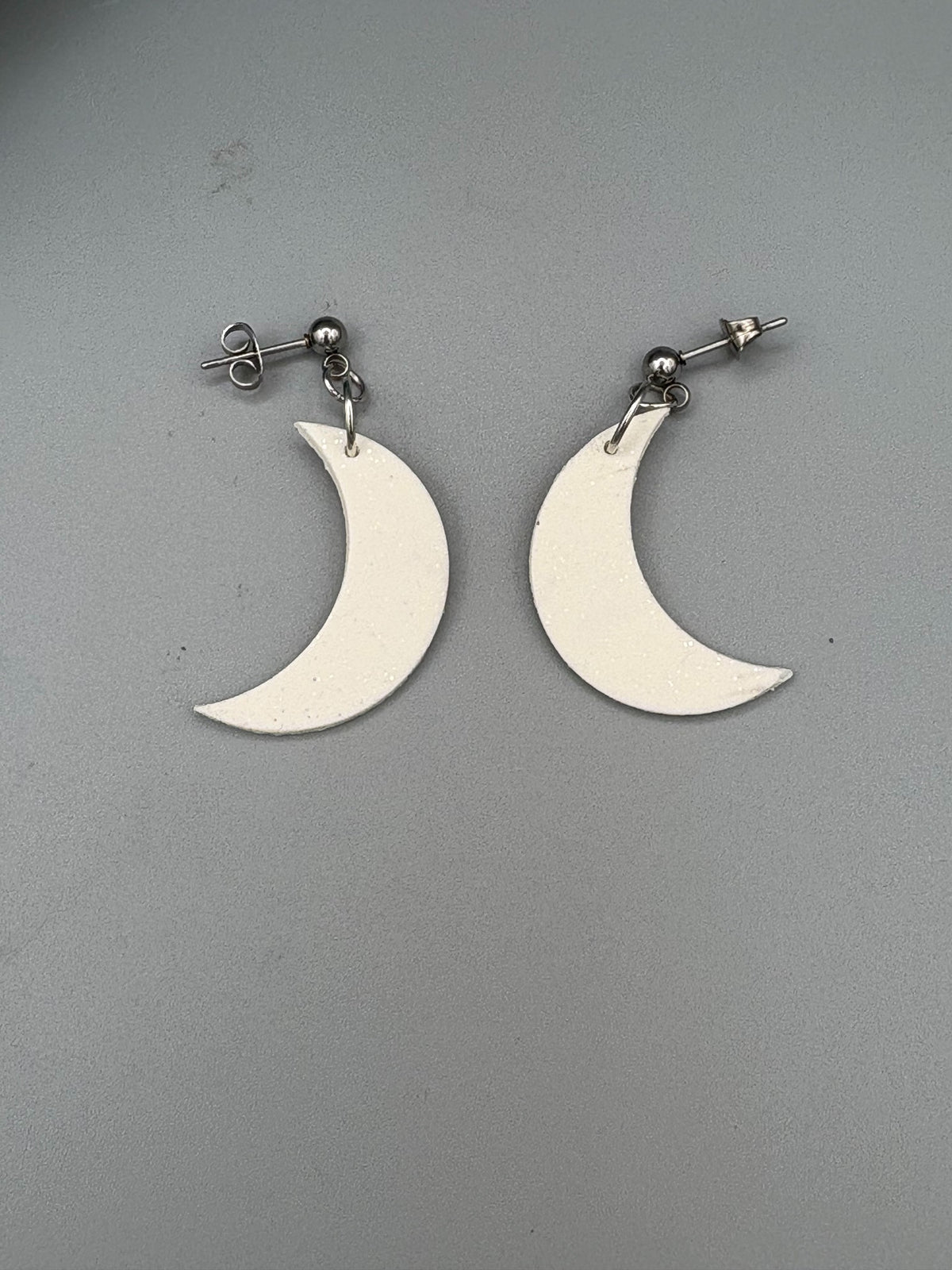 Sparkly White Moon Dangle Earrings - handcrafted polymer clay earrings by Lakeside Clay