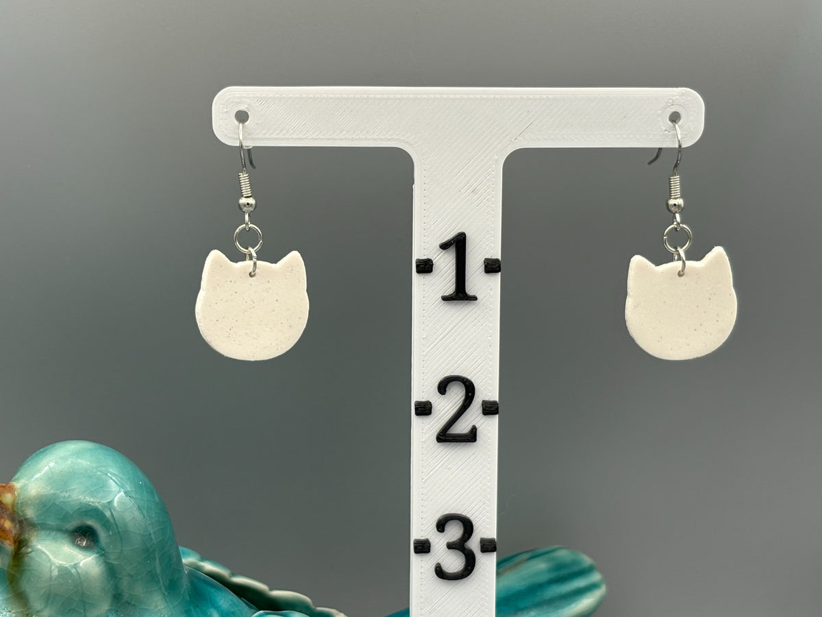 Boucles d'oreilles visages de chats blancs scintillants