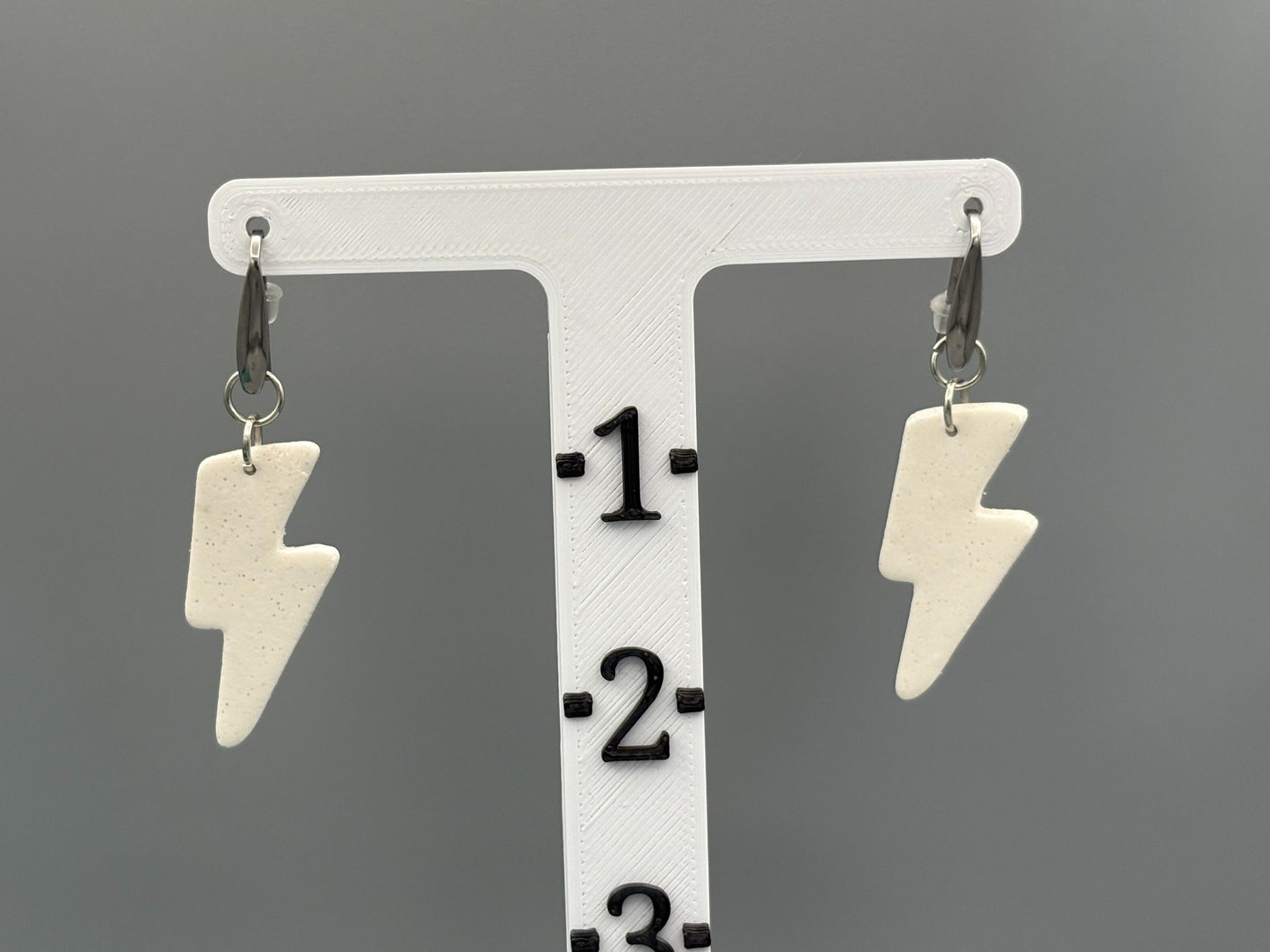 White Sparkly Lightning Bolt Dangle Earrings - handcrafted polymer clay earrings by Lakeside Clay