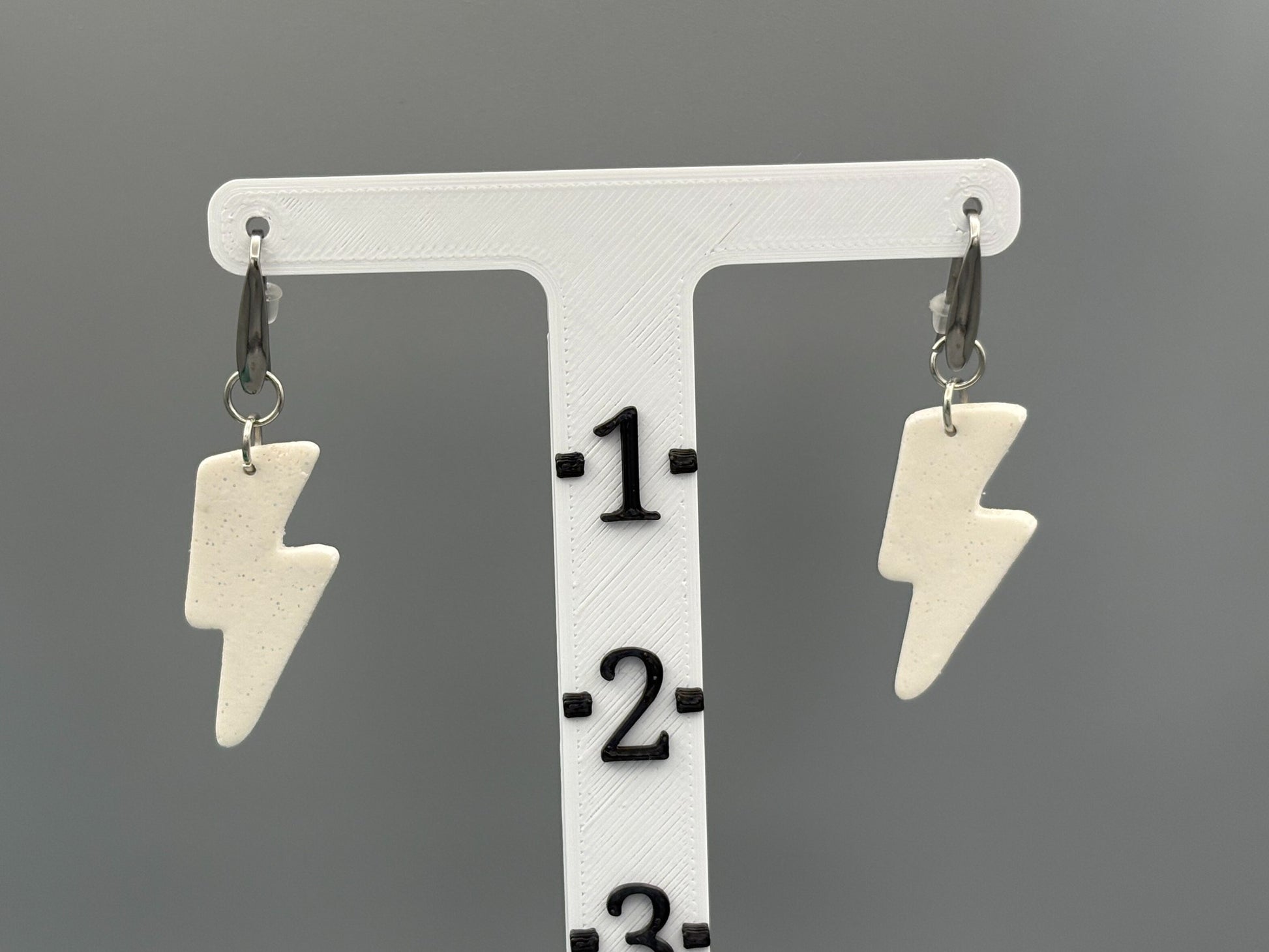 White Sparkly Lightning Bolt Dangle Earrings - handcrafted polymer clay earrings by Lakeside Clay