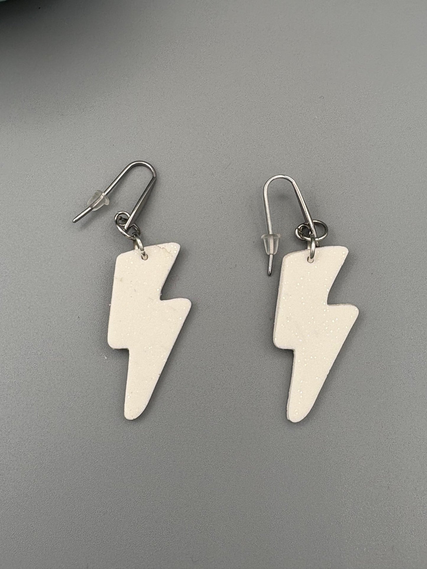 White Sparkly Lightning Bolt Dangle Earrings - handcrafted polymer clay earrings by Lakeside Clay