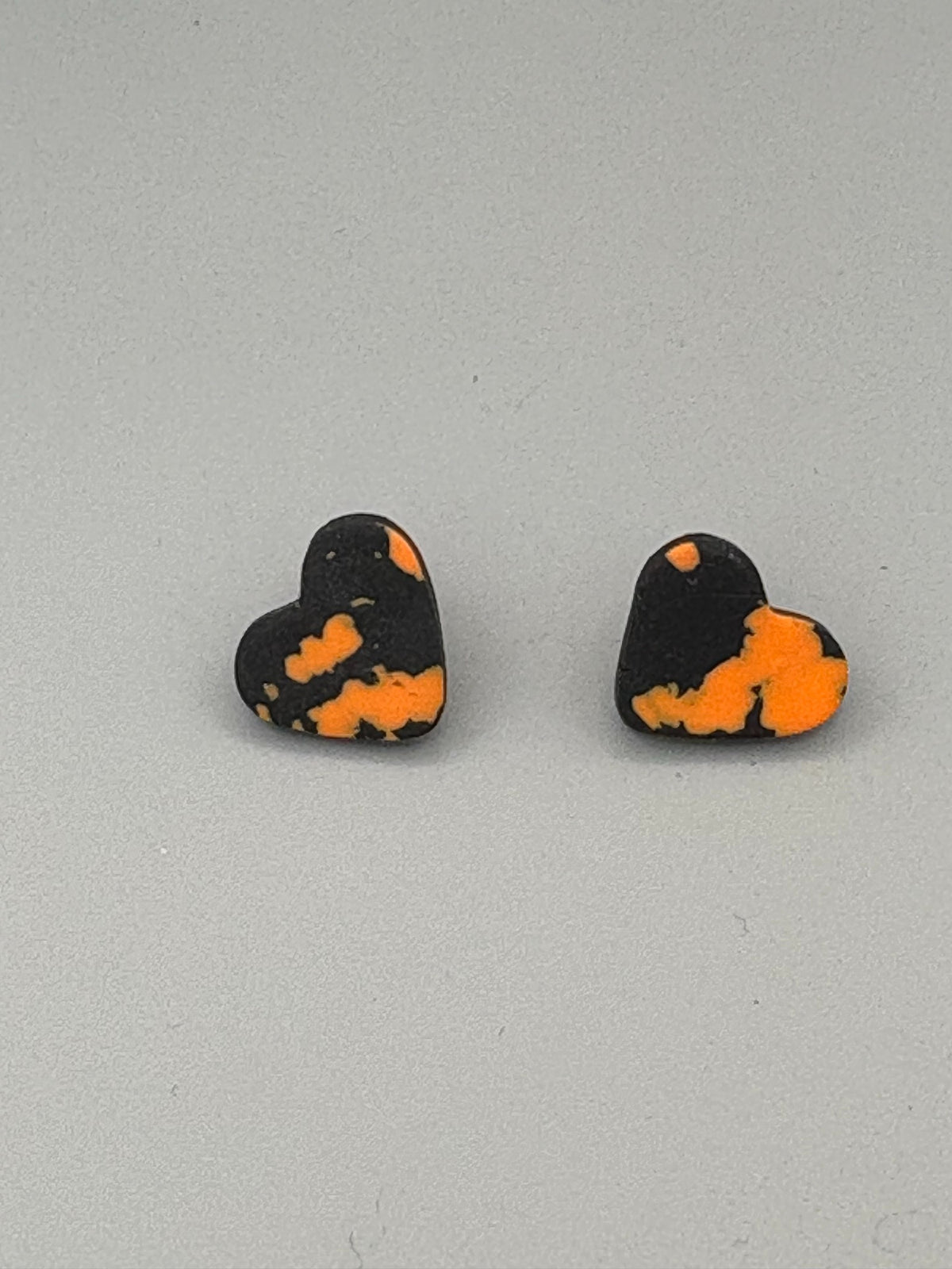 Black & Orange Heart Stud Earrings - handcrafted polymer clay earrings by Lakeside Clay