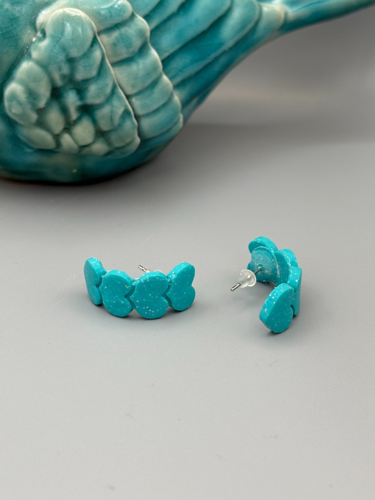 Sparkly Teal Heart Huggie Earrings - handcrafted polymer clay earrings by Lakeside Clay