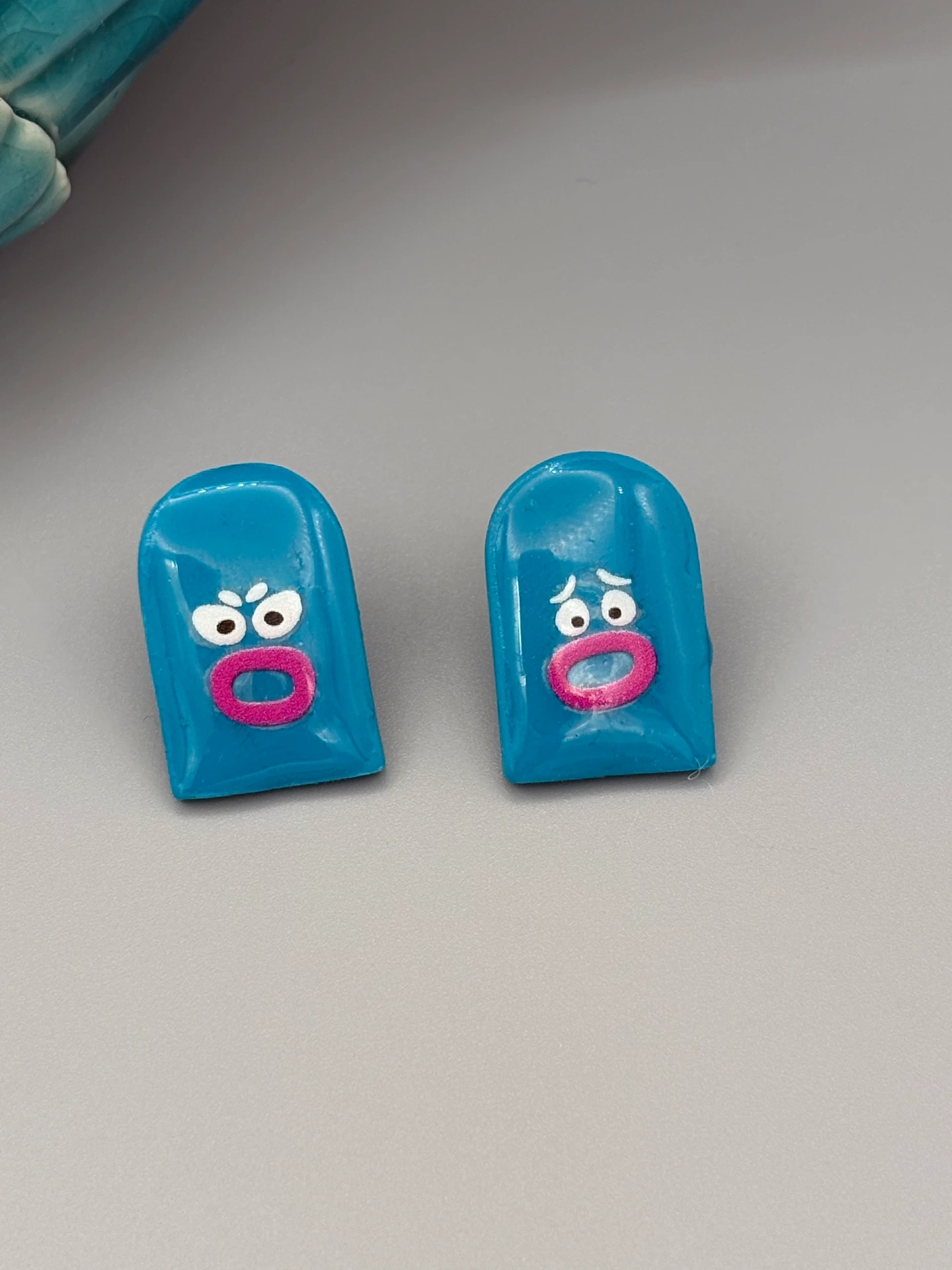 Teal Arch Funny Faces